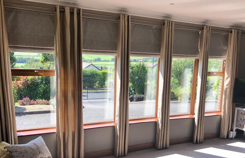Elegantly dressed window with blinds by Allshades